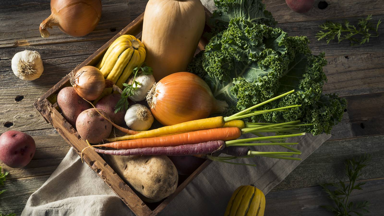 A basket full of fresh fruits and vegetables 