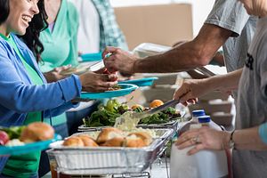 Image of a person receiving a healthy meal at food bank.