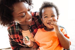 Mother and Child Eating Vegetables