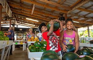 family at a farmer's market