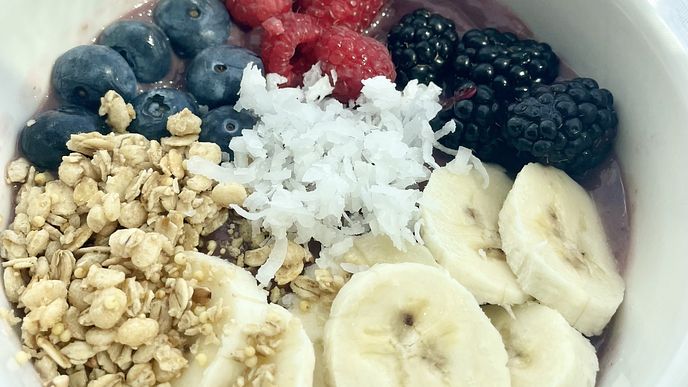 A smoothie bowl topped with fruit