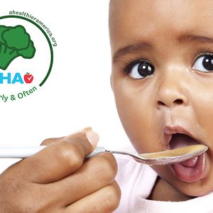 Child eating veggie-forward baby food