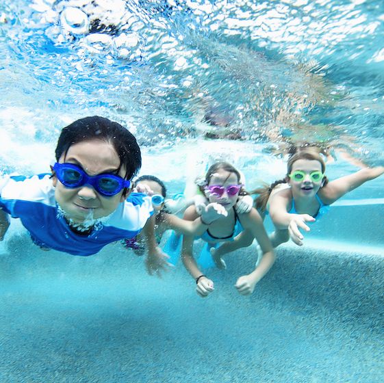 Image of children swimming underwater. 