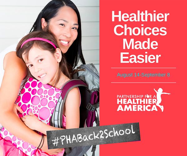 Image of a mom hugging her elementary school-aged child during back to school time.