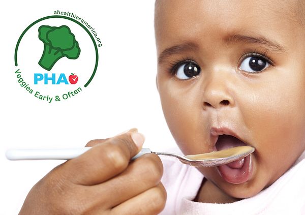 Child eating veggie-forward baby food