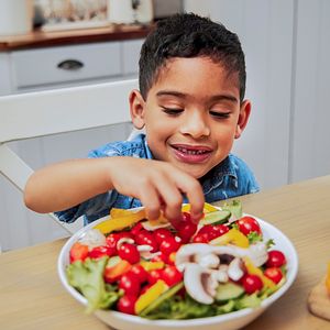 Boy eating salad