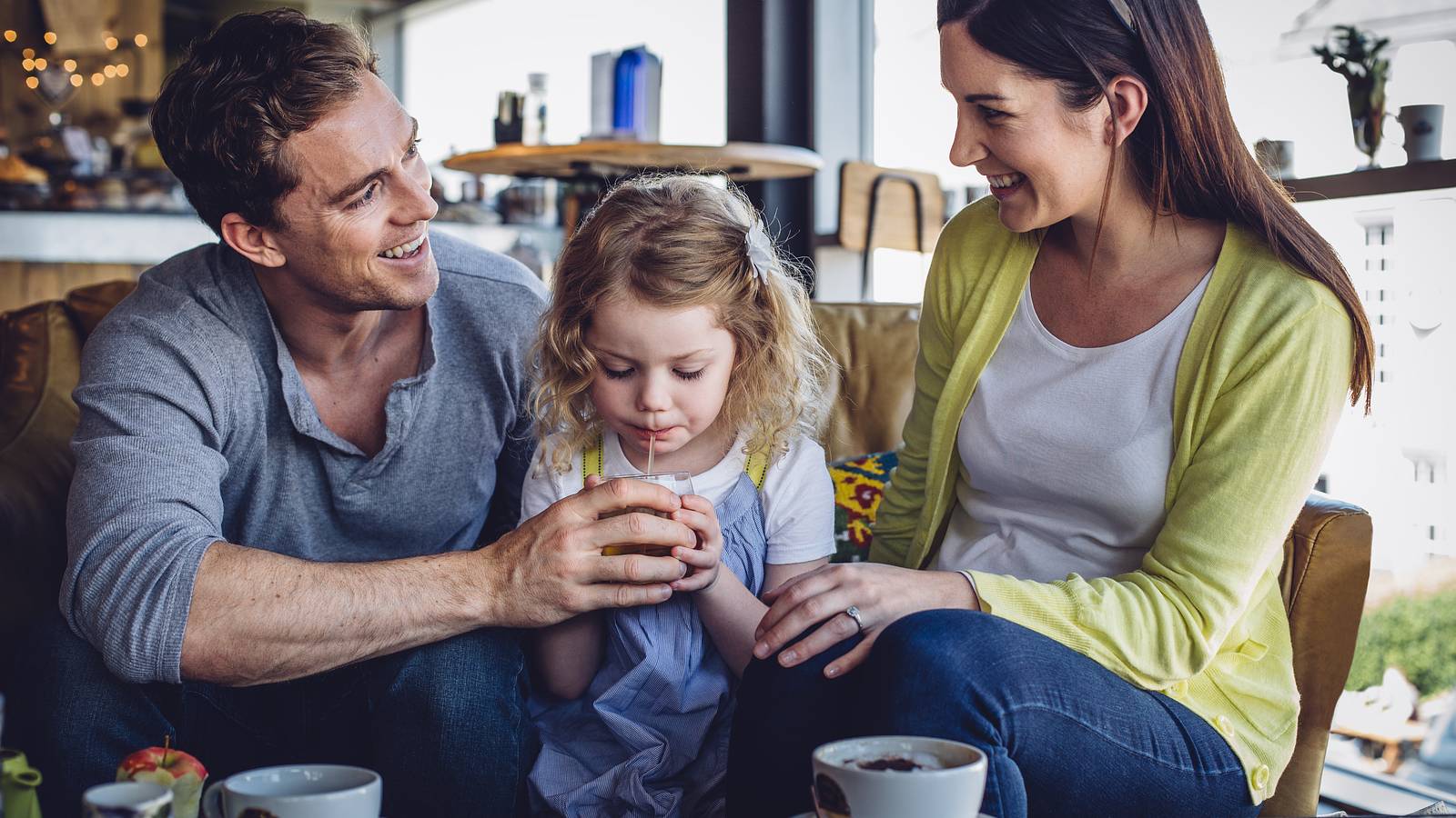 Image of a family enjoying healthier beverages in a hotel on the Partnership for a Healthier America's website. 