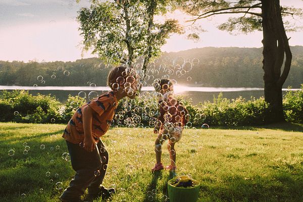 Kids playing with bubbles