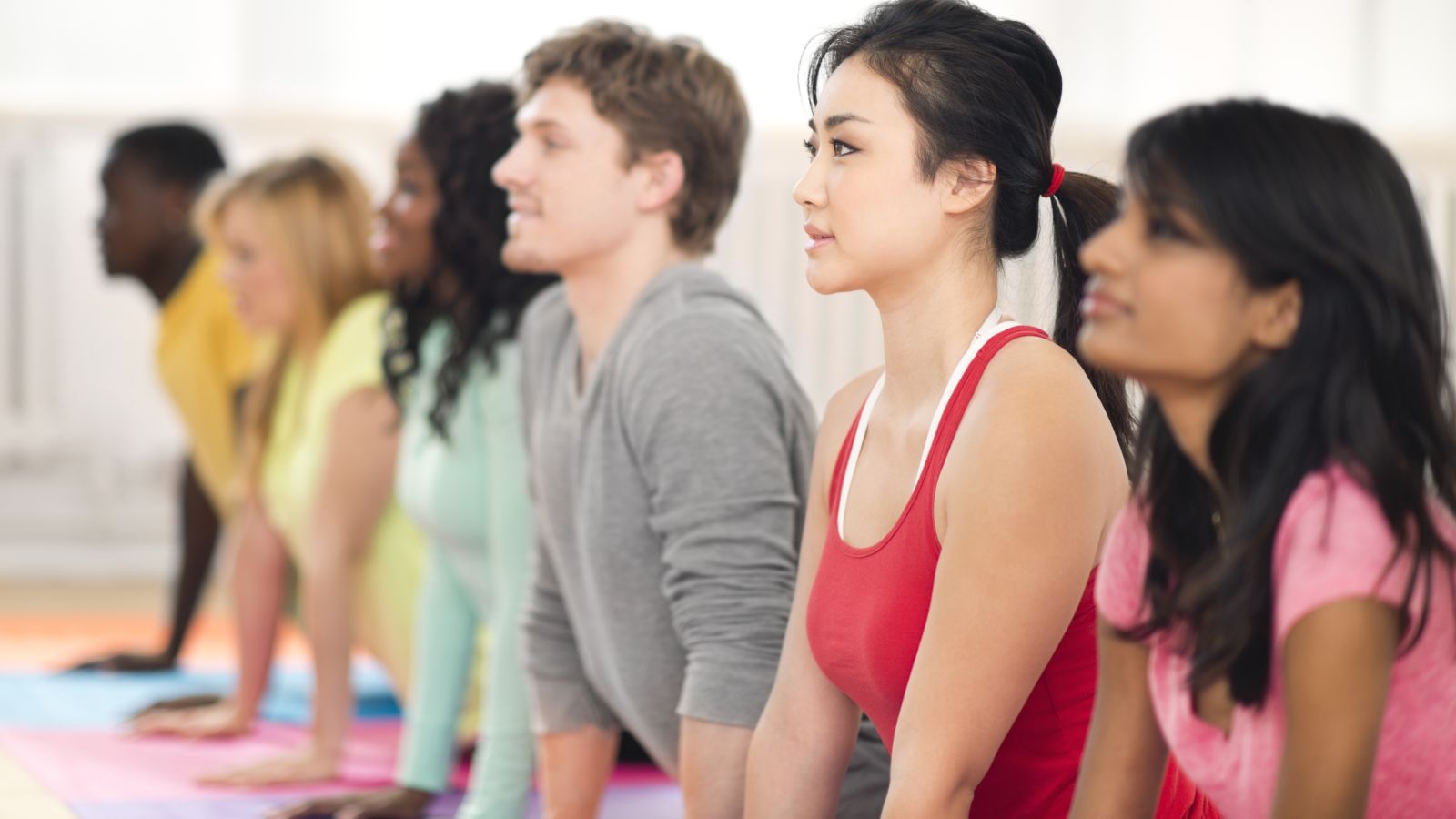 College students doing yoga as part of program to combat college obesity.