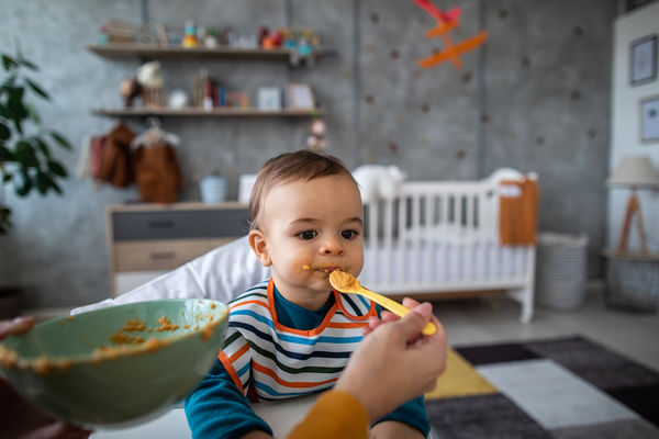 Baby eating sweet potato baby food