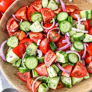 Cucumber Tomato Salad is a classic salad, light, crunchy, and refreshing. This simple salad is made with sliced cucumbers & juicy tomatoes and seasoned with red onions and a tangy vinaigrette dressing.