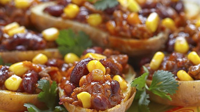 potato topped with turkey and cheese