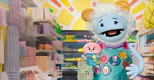 Waffles + Mochi show of their aprons after the badge challenge.