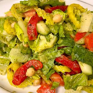 Salad and tomatoes with dressing