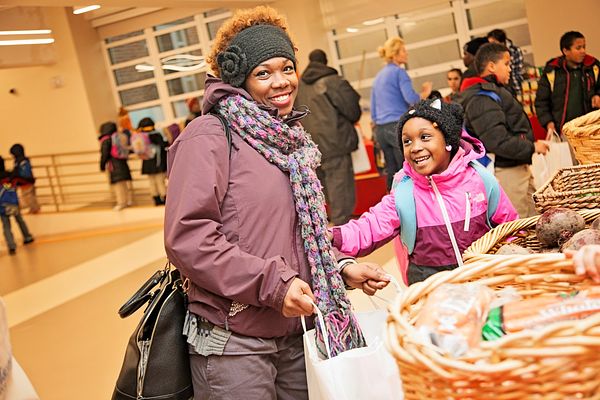 Mother and daughter receiving food at the Washington DC, Capital Area Food Bank 