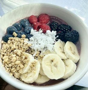 A smoothie bowl topped with fruit