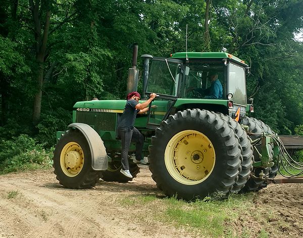 Anthony Jamerson outside of tractor.