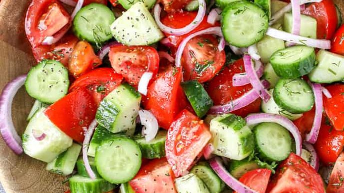 Cucumber Tomato Salad is a classic salad, light, crunchy, and refreshing. This simple salad is made with sliced cucumbers & juicy tomatoes and seasoned with red onions and a tangy vinaigrette dressing.
