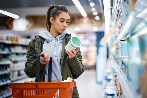 A woman grocery shops alone
