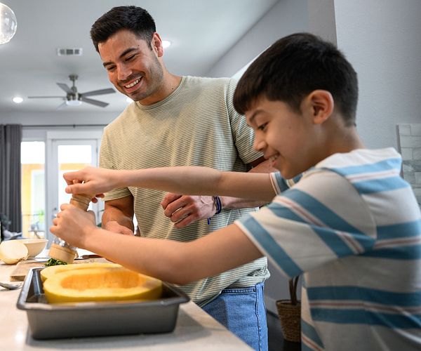 Father cooking with son