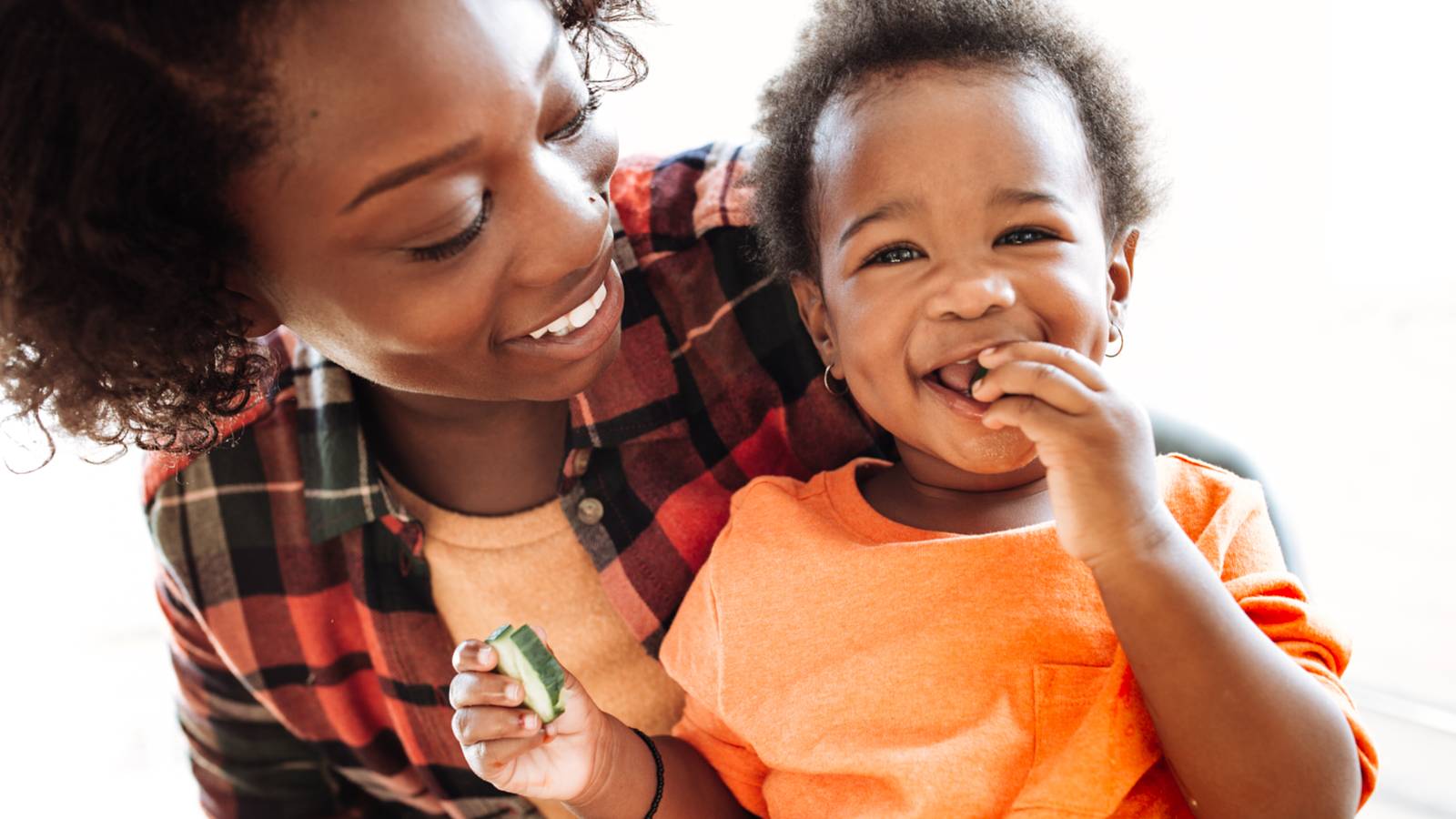 Mother and Child Eating Vegetables